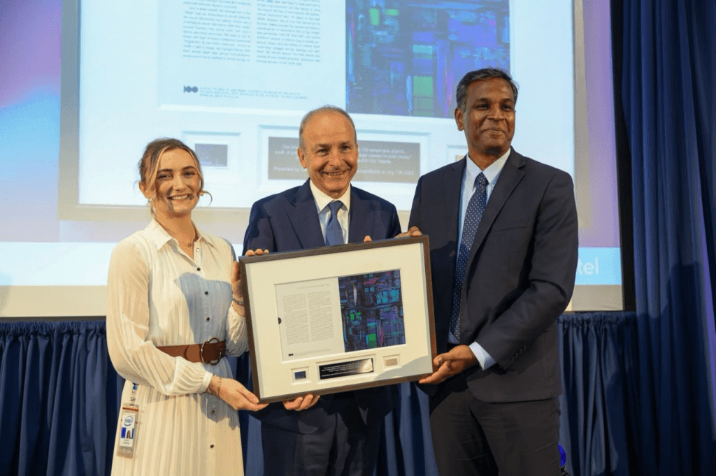 Tánaiste Micheál Martin and Naga Chandrasekaran holding the framed Pentium chip